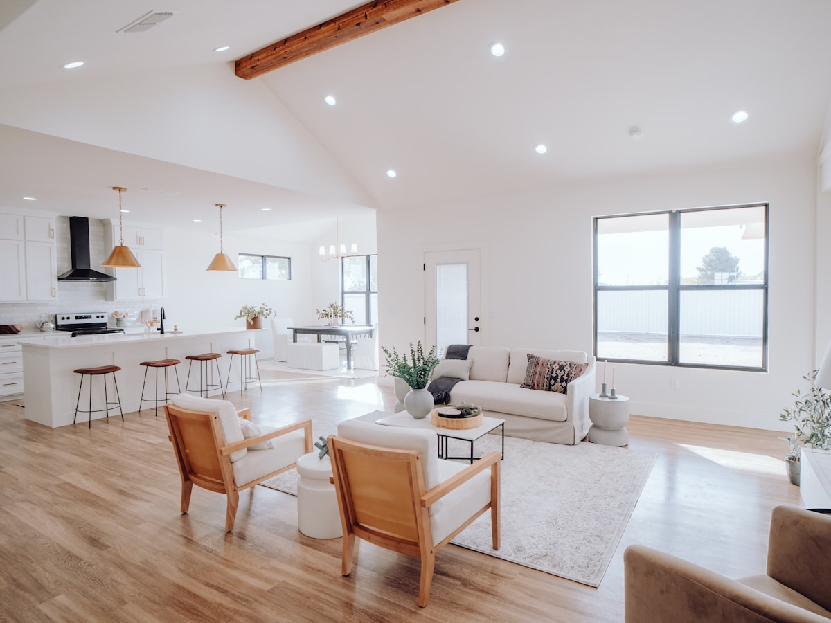 A bright, freshly cleaned open plan home with a spotless kitchen and living area